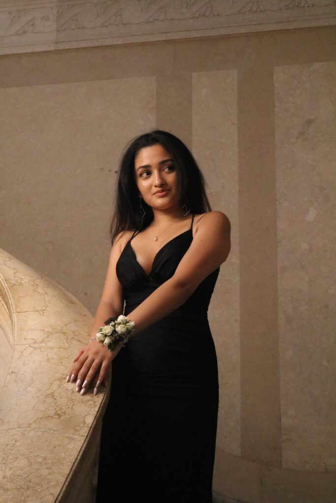 Portrait of woman in formal dress on staircase